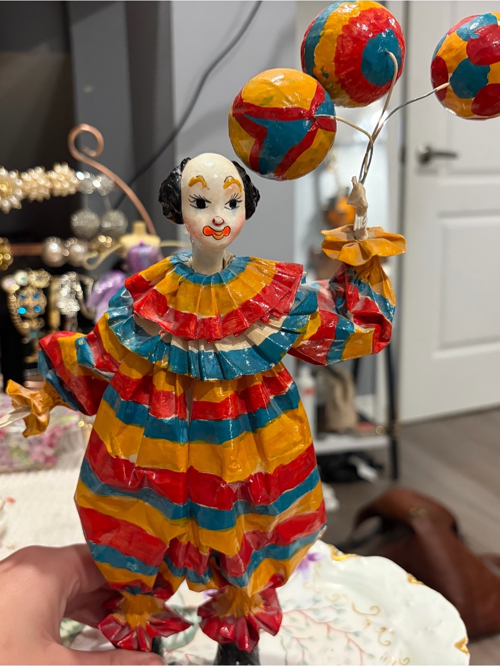 Colorful Striped Clown Figurine with Balloons